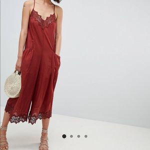 Rust colored romper with lace detail
